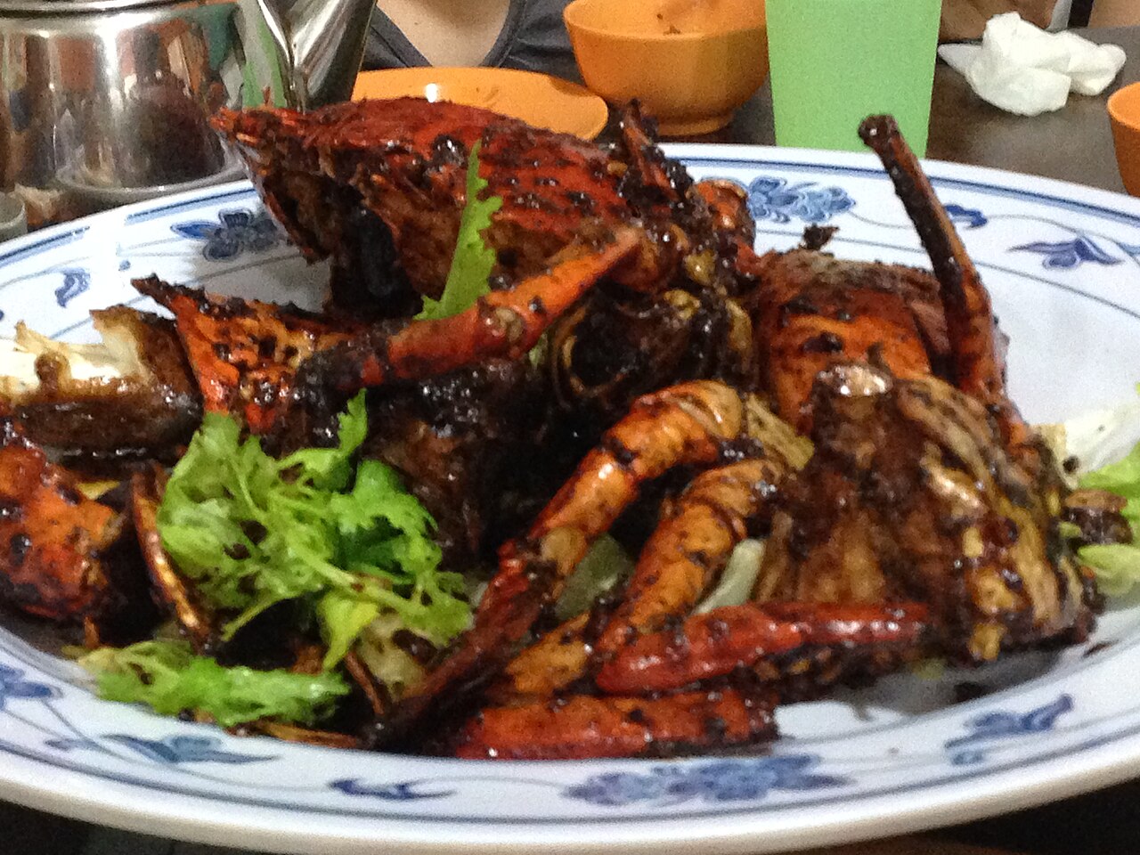A serving of black pepper crab coated in coarse black pepper sauce at New Ubin Seafood, Singapore