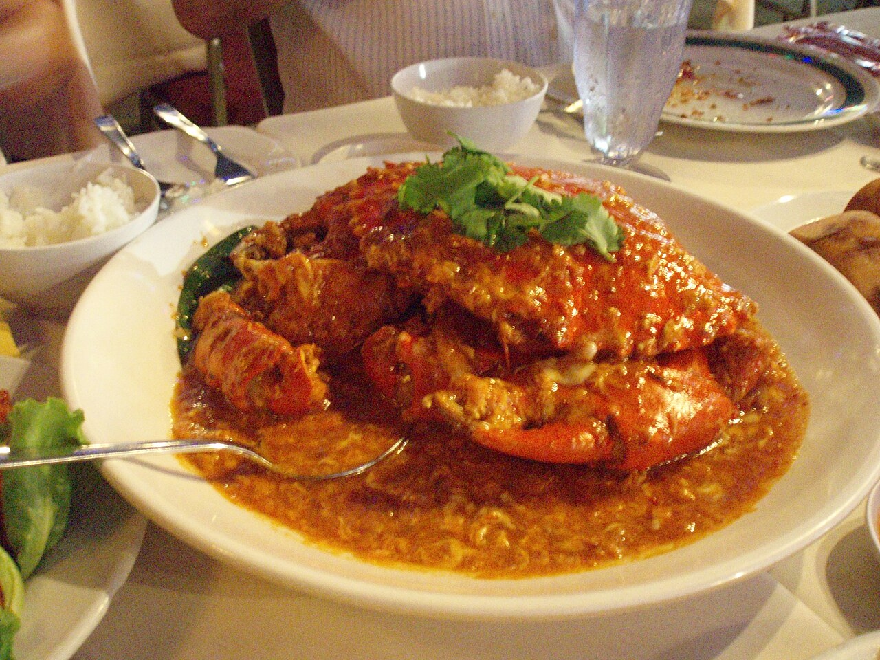 A plate of Singapore chilli crab with bright red gravy
