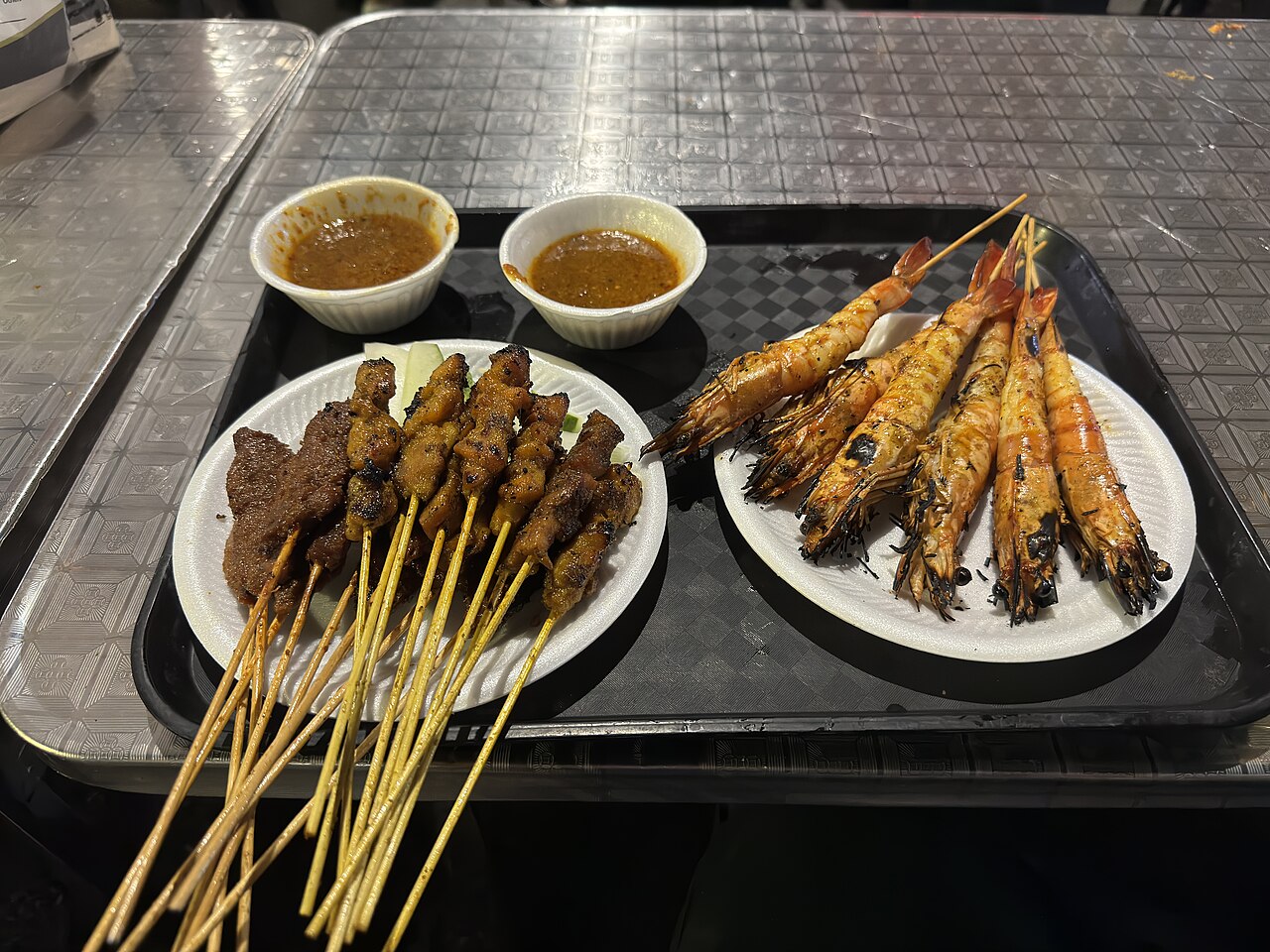 Skewers of charcoal-grilled satay at Lau Pa Sat hawker centre, Singapore