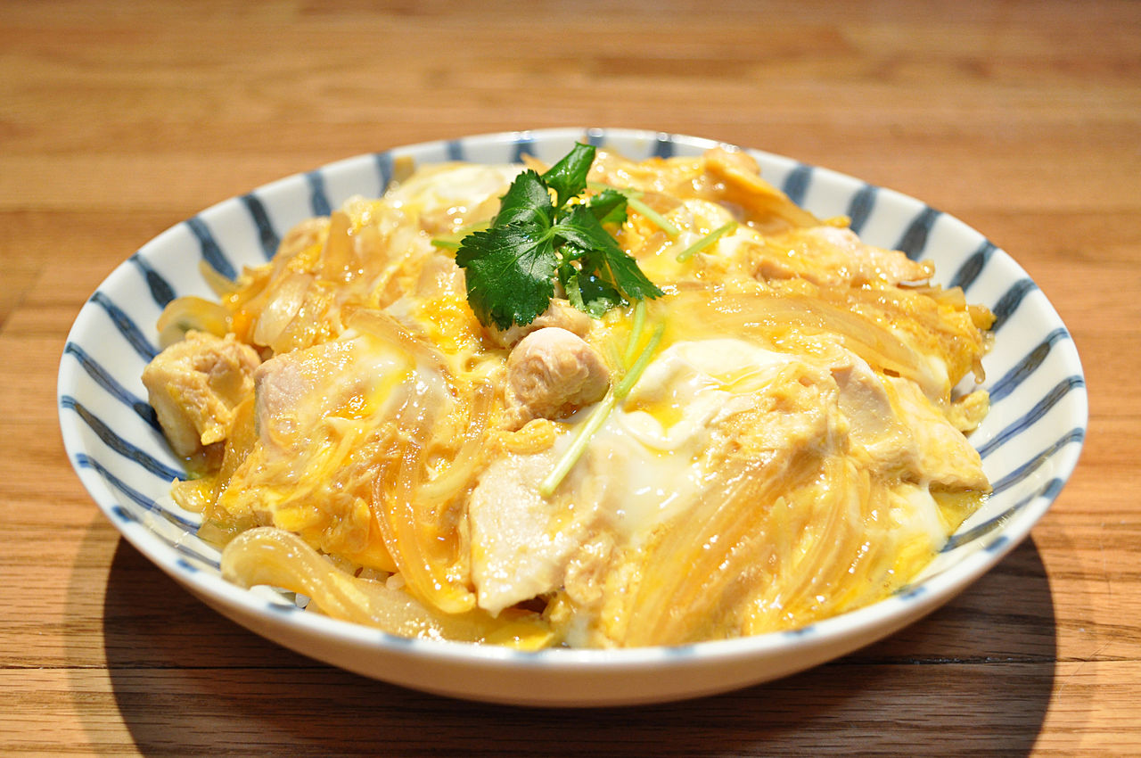 A bowl of oyakodon — simmered chicken and softly cooked egg over steamed rice