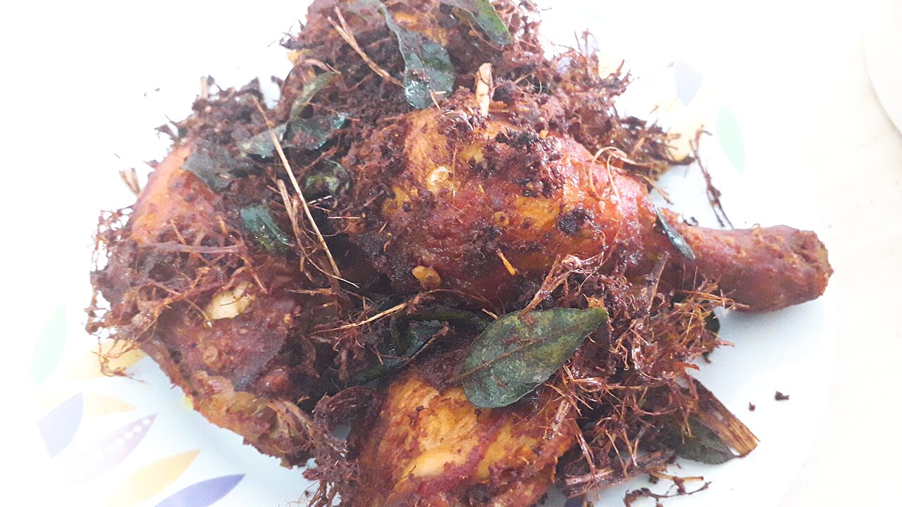 Pieces of ayam goreng berempah — chicken marinated in Malay spices and deep-fried until crispy