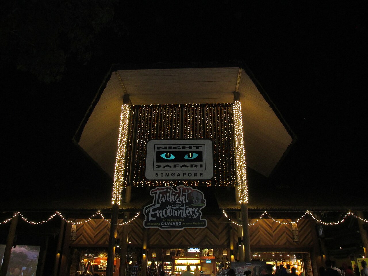 The illuminated entrance archway of Singapore's Night Safari at Mandai
